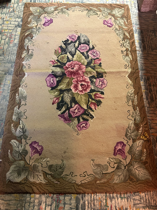 Antique floral hand hooked rug